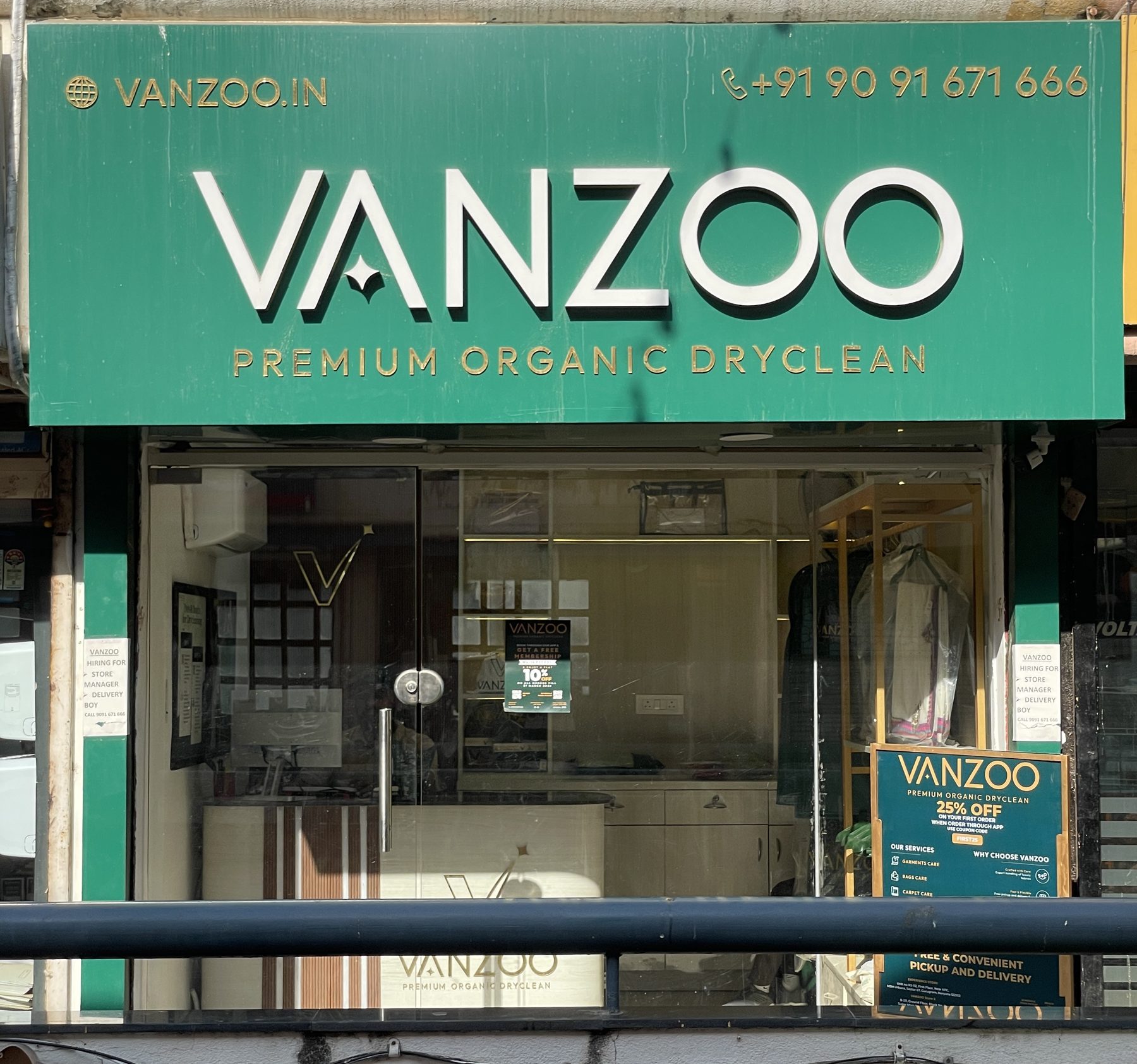 Vanzoo store front in Gurgaon with the green VANZOO Premium Organic Dryclean signboard