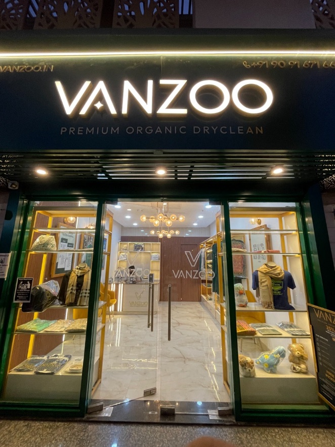 Vanzoo storefront in Gurgaon — Premium Organic Dryclean, with garments and accessories displayed in the window